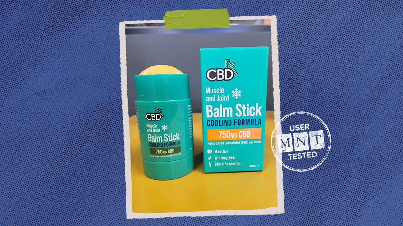 Tester review photo of CBDfx balm by Alice Porter-McLaughlin, isolated over blue background.