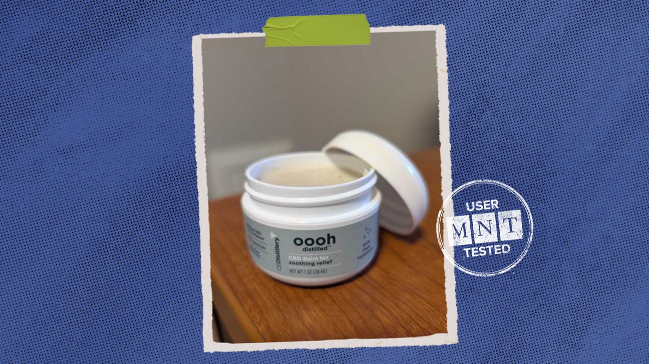 tester review photo of CBDdistillery balm by Margaret McMurray, isolated over blue background..