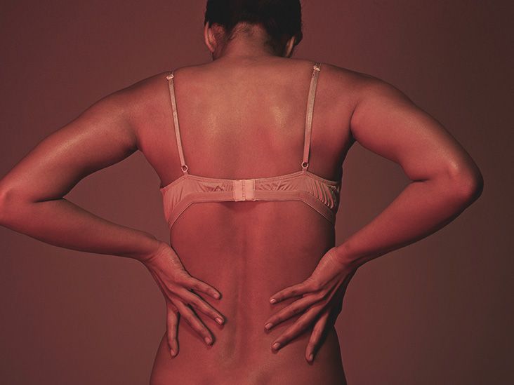 Our massive boobs mean we suffer from backache, depression - and
