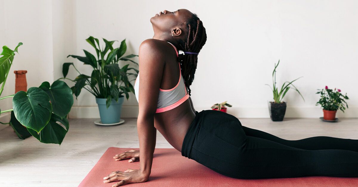 Young fit woman doing a yoga pose standing with... - Stock Photo [69448222]  - PIXTA