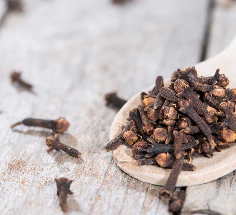 https://media.post.rvohealth.io/wp-content/uploads/2020/01/cloves-on-wooden-spoon-800x728.jpg?utm_source=chatgpt.com