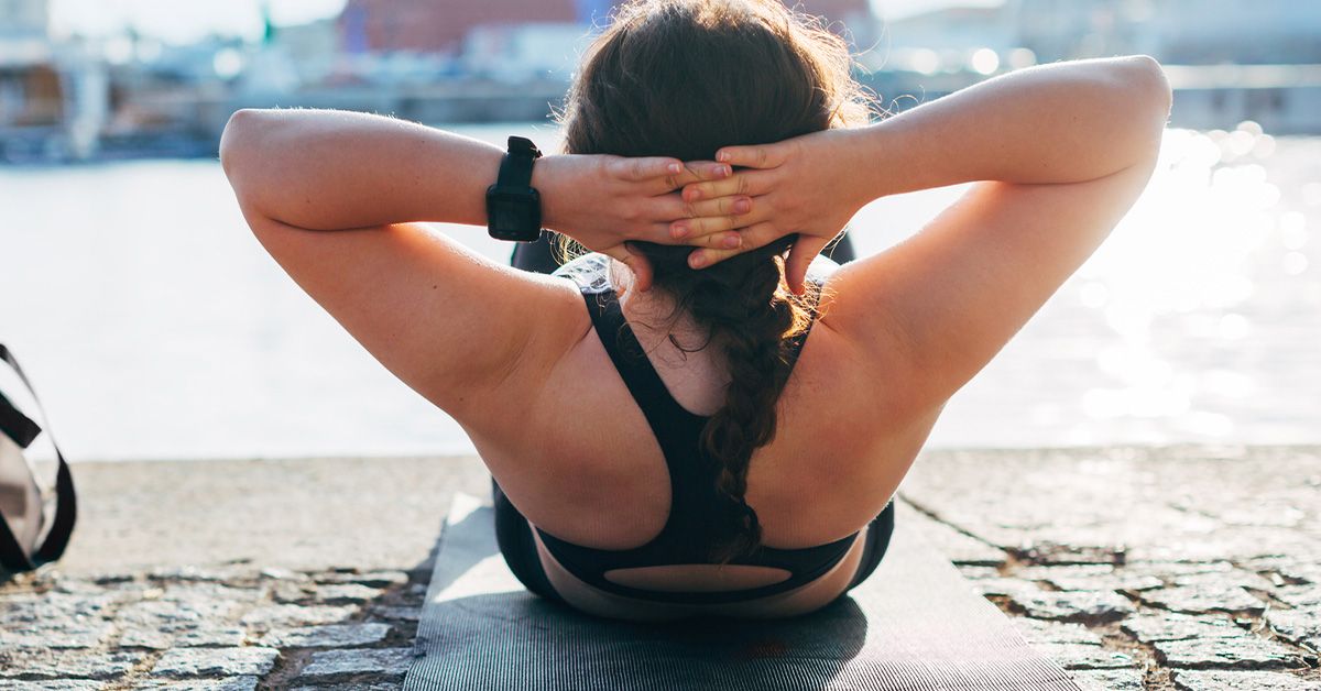 https://media.post.rvohealth.io/wp-content/uploads/2020/01/woman-exercising-outdoors-situps-yoga-hiit-1200x628-facebook.jpg