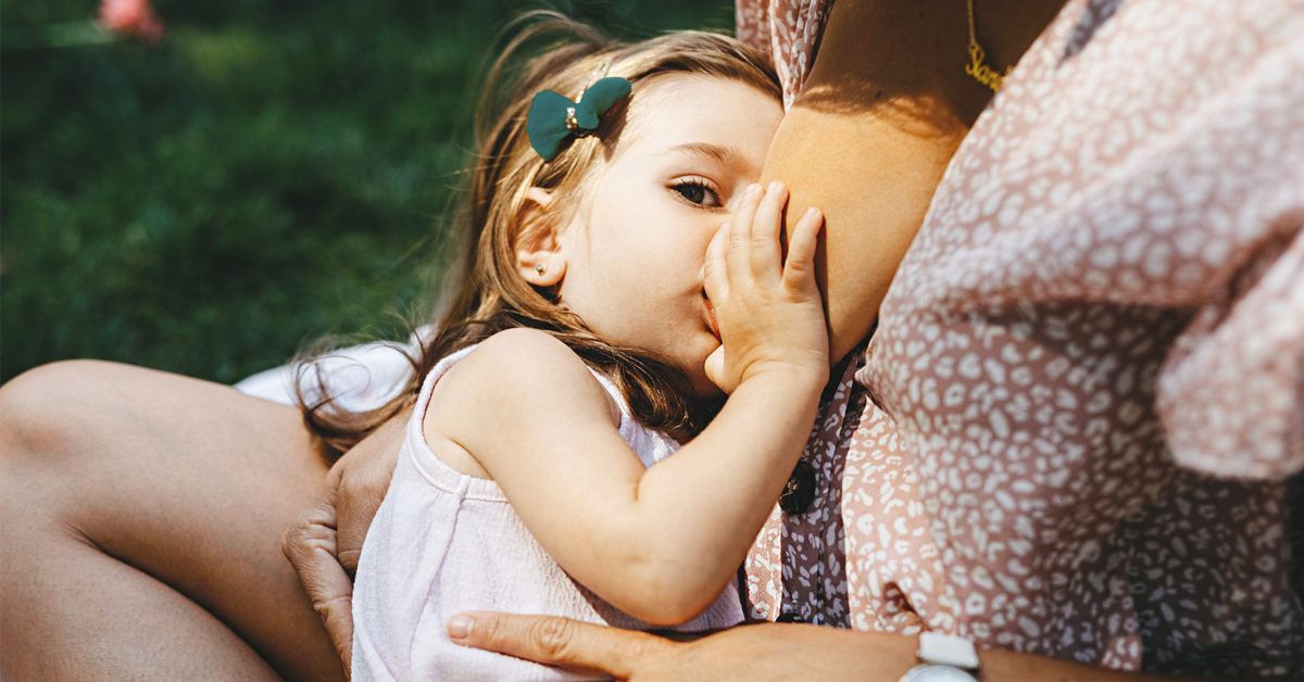 https://media.post.rvohealth.io/wp-content/uploads/2020/03/toddler_breastfeeding_outdoors-1200x628-facebook2-1200x628.jpg