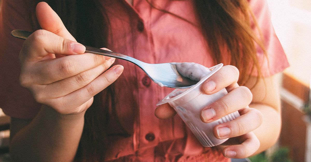 https://media.post.rvohealth.io/wp-content/uploads/2020/03/woman-eating-yogurt-1200x628-facebook-1200x628.jpg