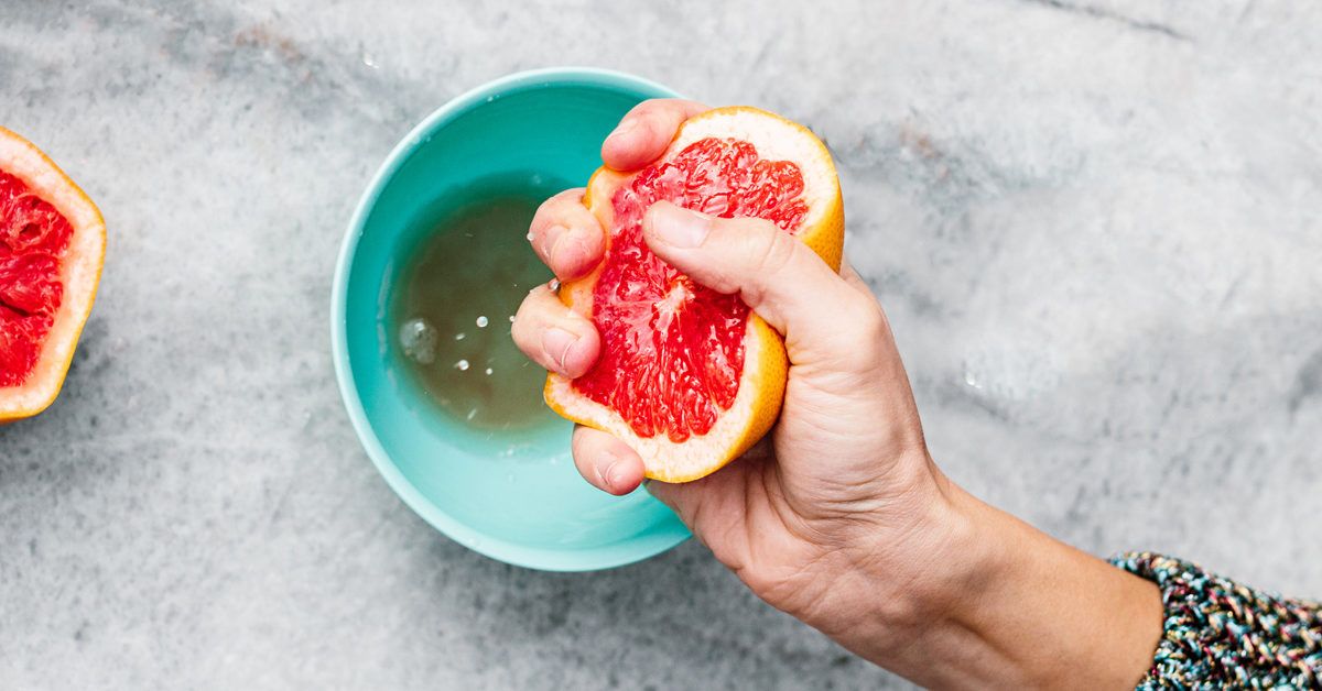 Woman With Four Arms Holding Fruit And Cakes In Each Hand Stock