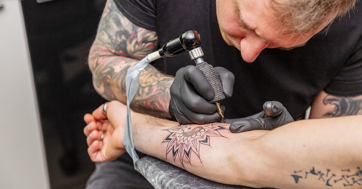 Do tattoos hurt What it feels like areas pain relief and more