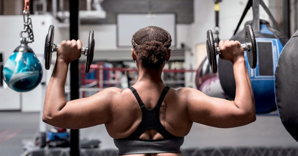 Free Weights vs. Machines: 8 Benefits, Form Tips, Weights, and More
