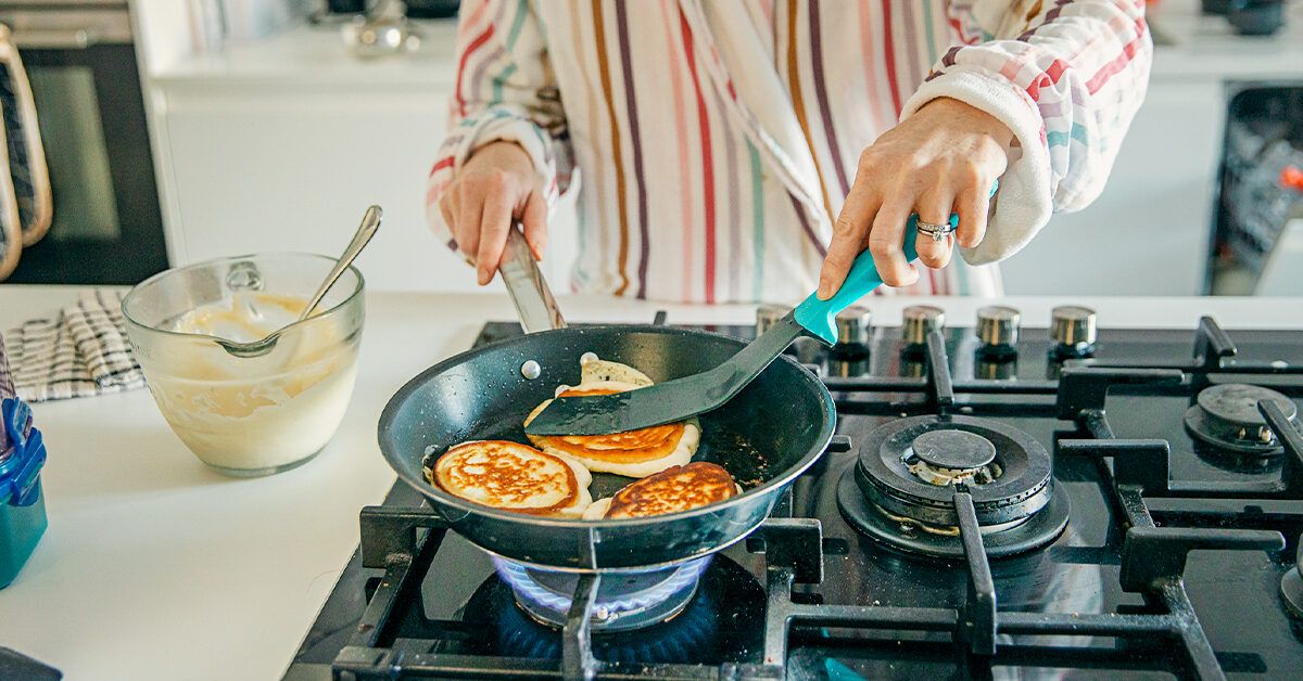 https://media.post.rvohealth.io/wp-content/uploads/2020/06/Woman-cooking-homemade-pancakes-facebook-1200x628.jpg