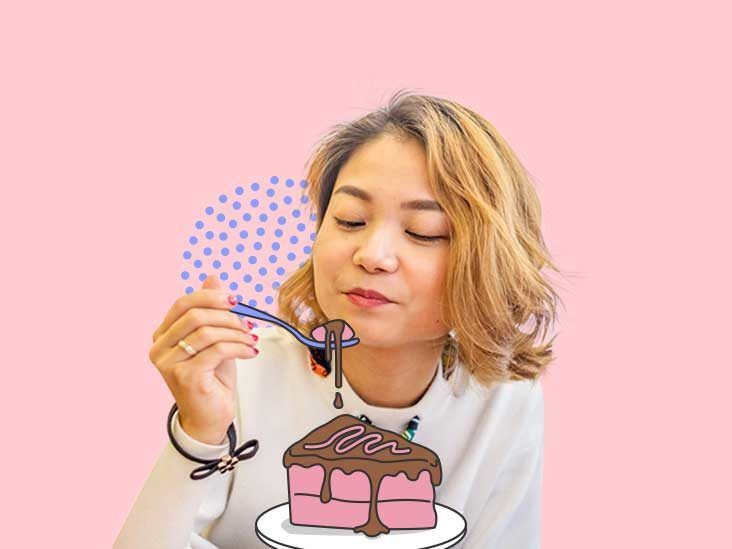 Premium Photo | Cheerful young young woman enjoys sweet chocolate, doesn`t  think about figure, being in good mood as eats sweets, poses against pink.  people, desserts, sweet tooth