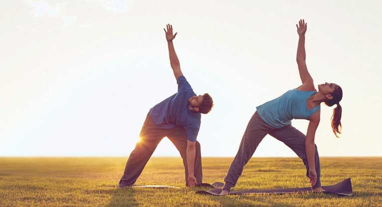 women and men practice acrobatics yoga Stock Photo - Alamy