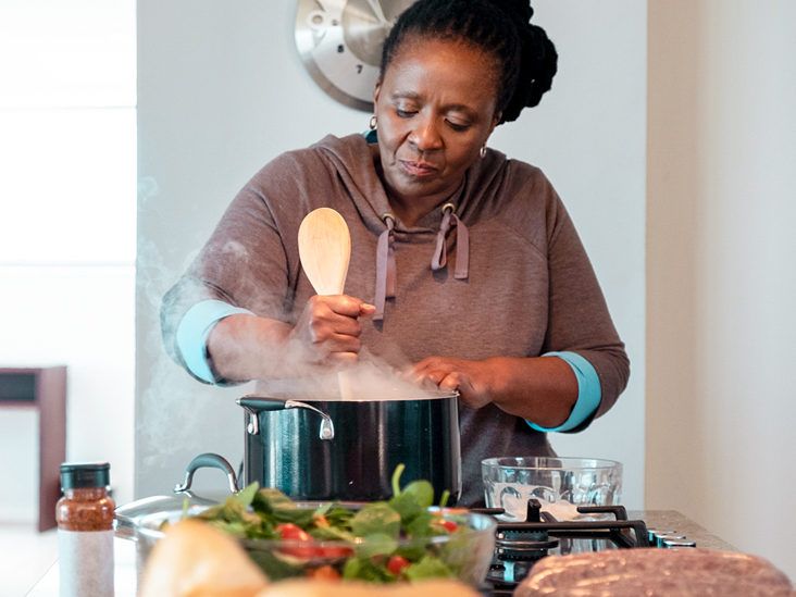 https://media.post.rvohealth.io/wp-content/uploads/2020/08/Senior-woman-cooking-food-in-the-kitchen-732x549-thumbnail-1-732x549.jpg