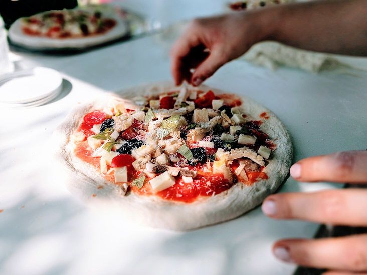 4 Reasons You and Your Friends Should Enjoy a Slice of Pizza — Top in Town  Pizza