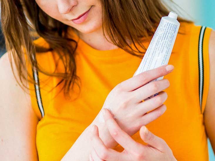 woman putting ointment hand 732x549 thumbnail