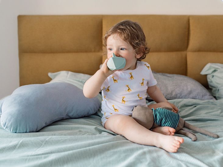 2 month old baby store putting hands in mouth