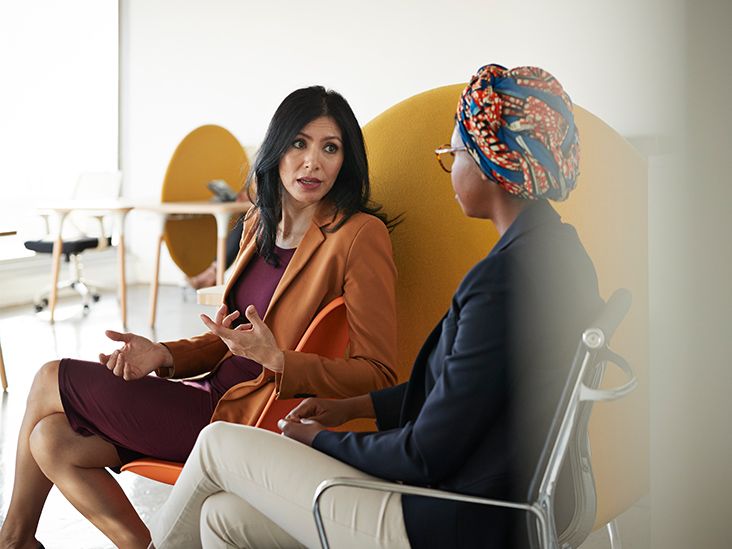 Asian Women Using Neck Pillow and Resting on Office Chair Isolat