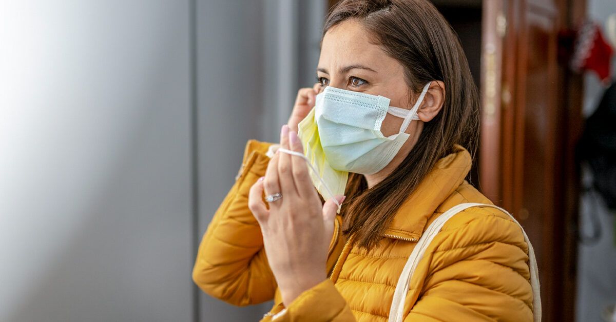 https://media.post.rvohealth.io/wp-content/uploads/2021/02/Woman-wearing-double-face-mask-before-going-out-1200x628-facebook-1200x628.jpg