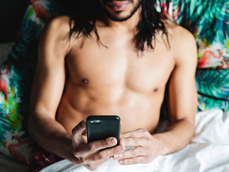 https://media.post.rvohealth.io/wp-content/uploads/2021/07/male-holding-phone-in-bed-732-549-feature-thumb-732x549.jpg