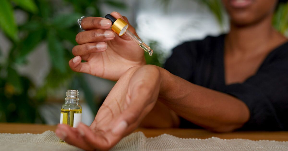 https://media.post.rvohealth.io/wp-content/uploads/2021/08/African-American-Woman-putting-essential-oil-on-her-arm-1296x728-header-1200x628.jpg