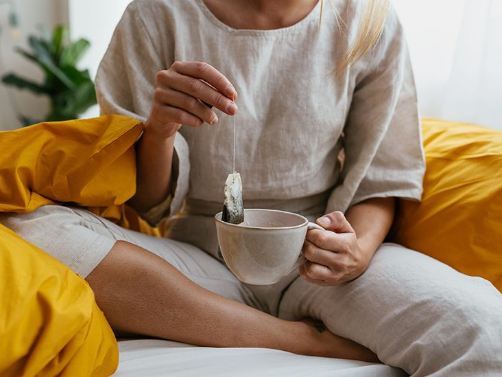 https://media.post.rvohealth.io/wp-content/uploads/2021/12/female-on-bed-holding-tea-732-549-feature.jpg?utm_source=chatgpt.com