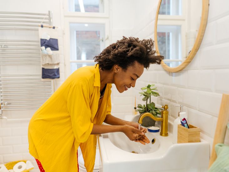 https://media.post.rvohealth.io/wp-content/uploads/2022/03/young_african_american_woman_washing_face_in_bathroom-732x549-thumbnail.jpg