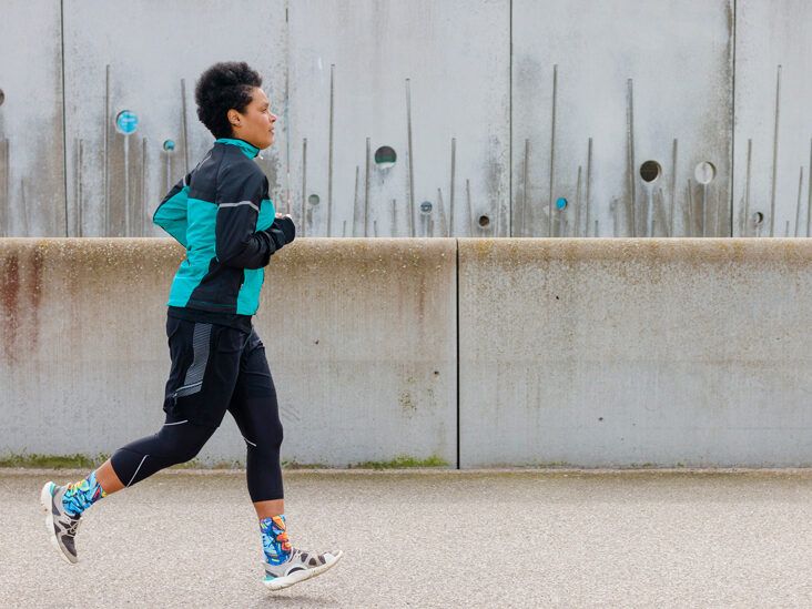 A person jogging in nature in the early morning hours. Fresh air