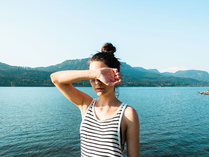 https://media.post.rvohealth.io/wp-content/uploads/2022/06/female-covering-eyes-in-sun-732-549-feature-thumb-732x549.jpg