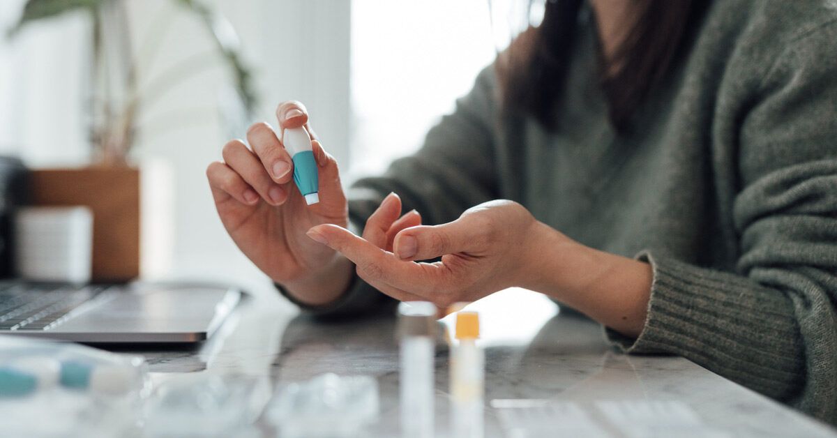 https://media.post.rvohealth.io/wp-content/uploads/2023/02/woman-doing-finger-prick-blood-test-at-home-1200x628-facebook-1200x628.jpg