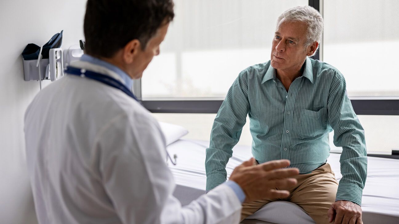 A man talks to a physician.