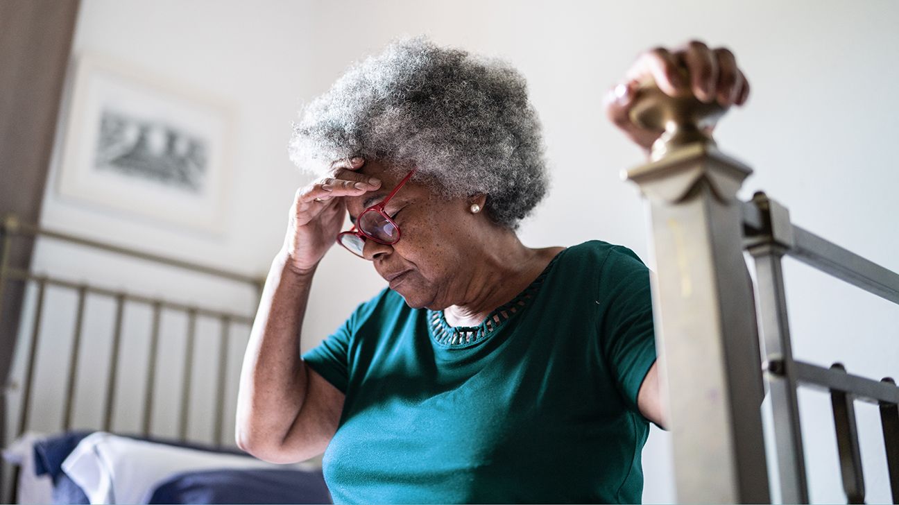 older woman feeling faint upon standing