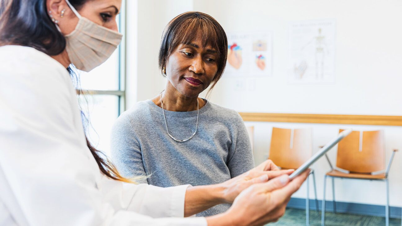 Doctor talking with a patient.
