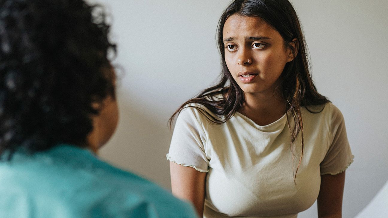 young person talking to a healthcare professional