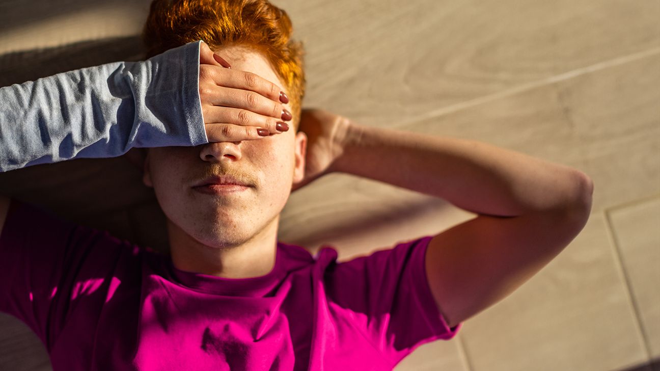 Person covering eyes from sun