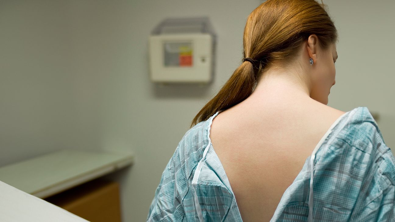 Woman in a hospital gown