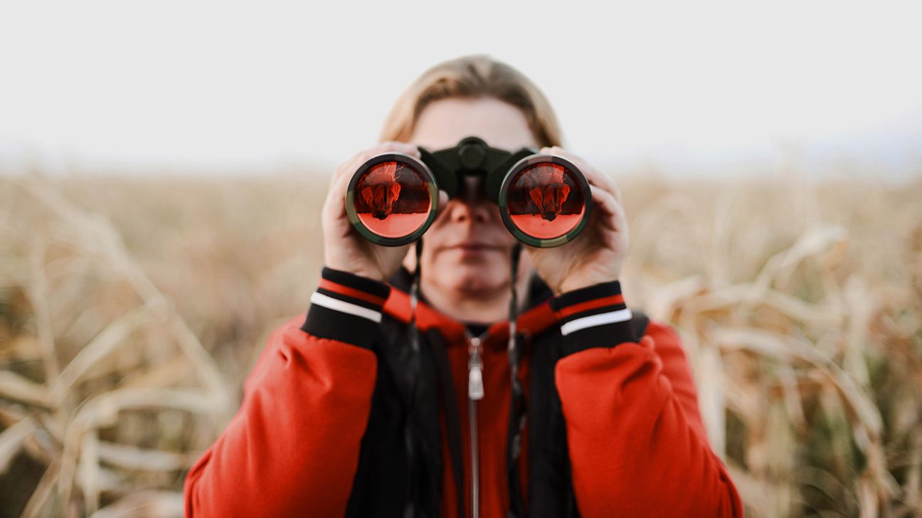 binoculars being held