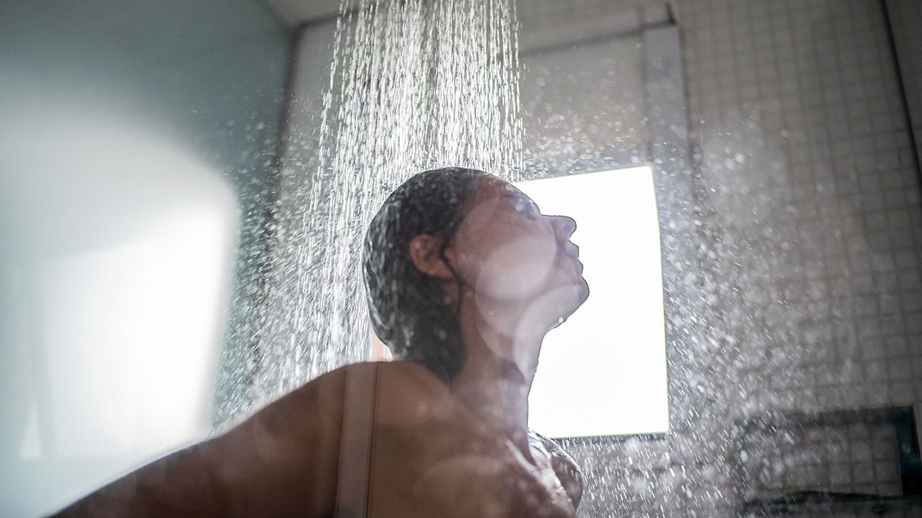 woman taking hot shower