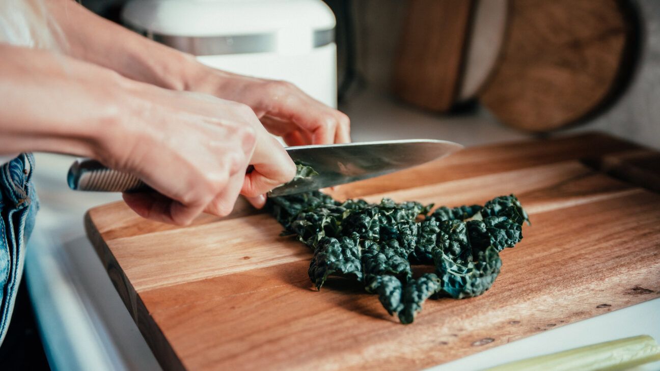 Photo of kale being chopped on cutting board