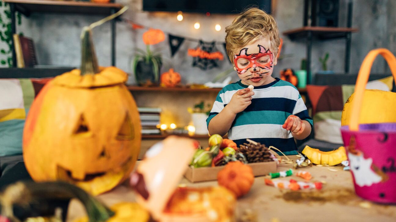 A young child eating candy.