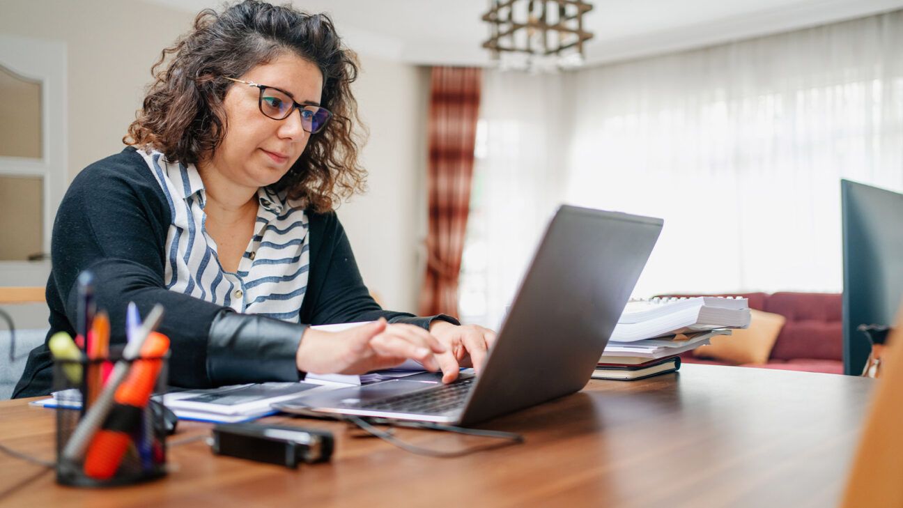 A woman using a laptop computer.