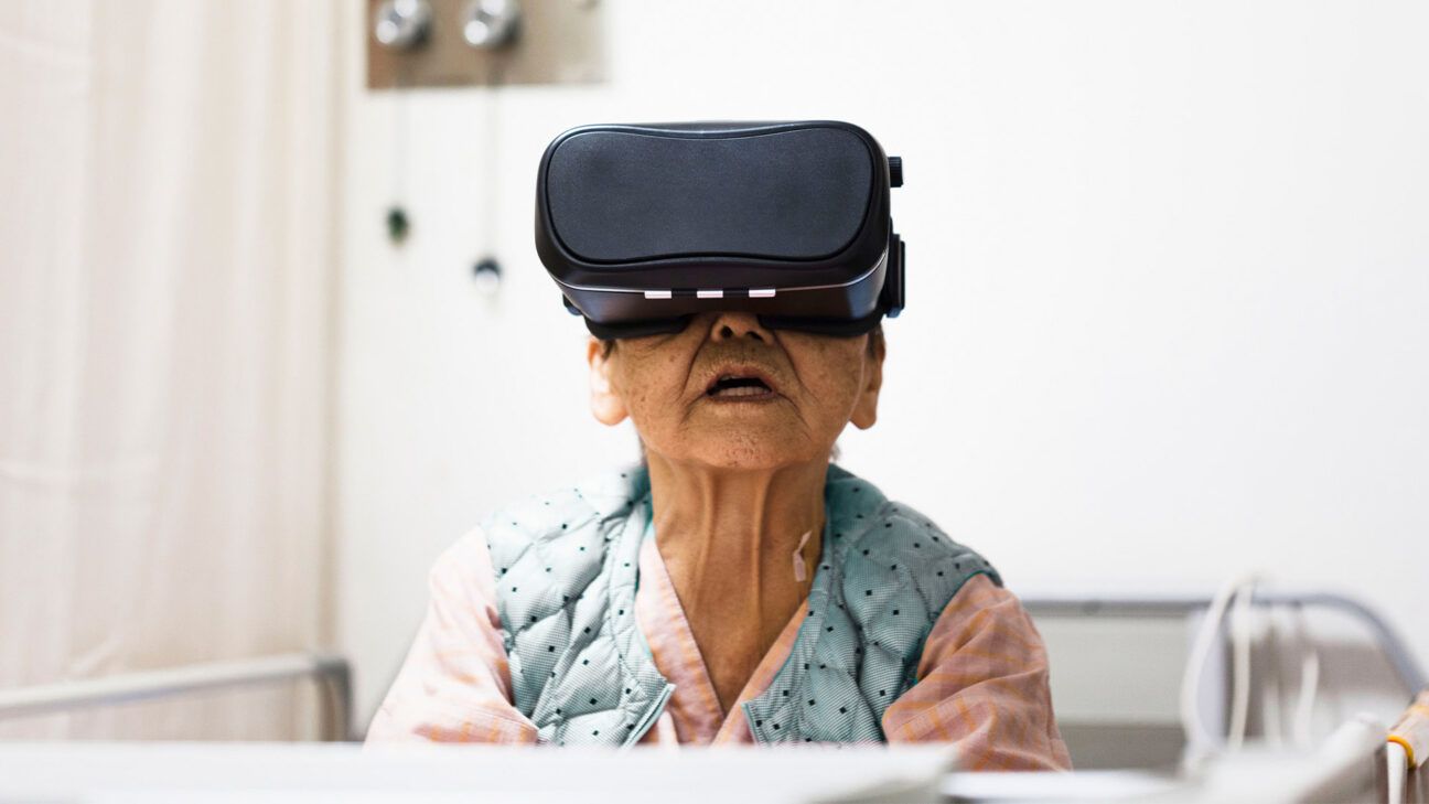 A woman is seen wearing a VR device.