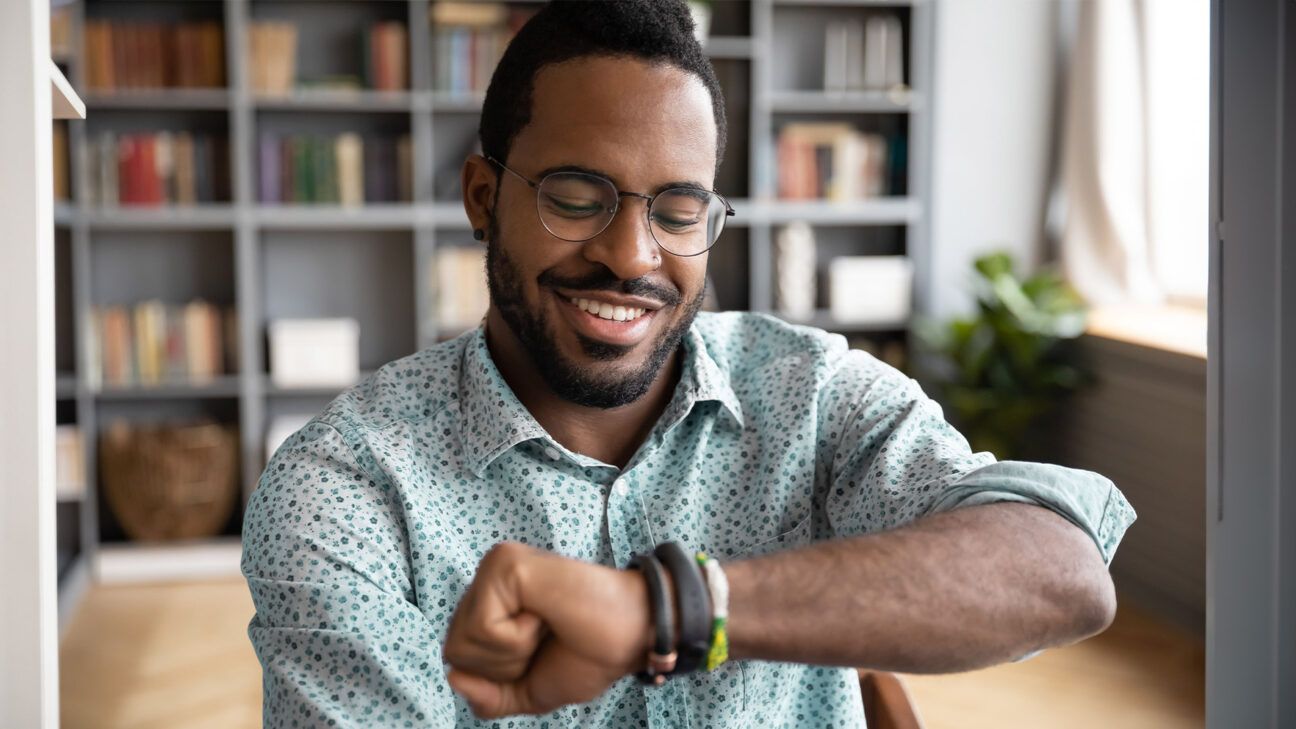 Man looking at smartwatch