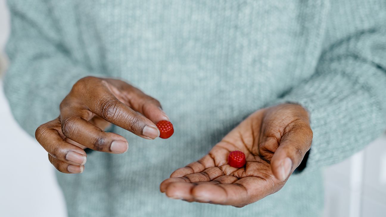 holding gummies in hand