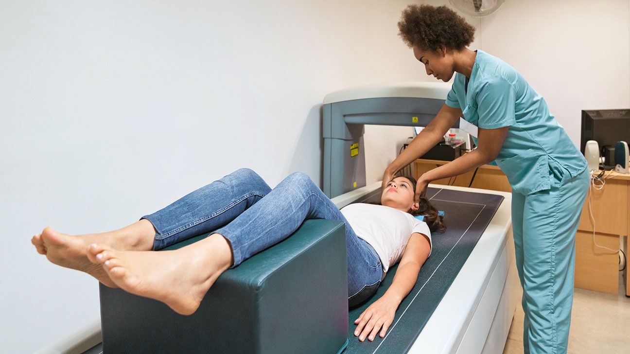 young woman having a bone density scan