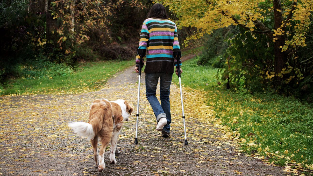 person with osteoporosis taking a hike