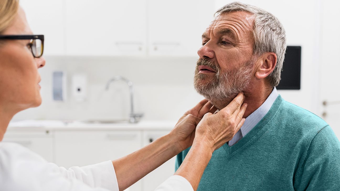 person getting an exam for laryngeal cancer