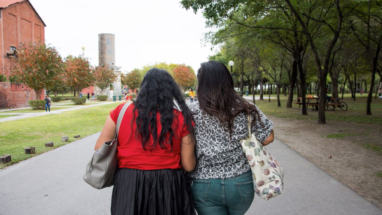 Two women walking.