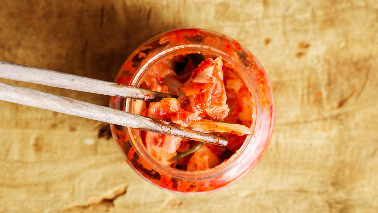 A jar of kimchi is seen from above.