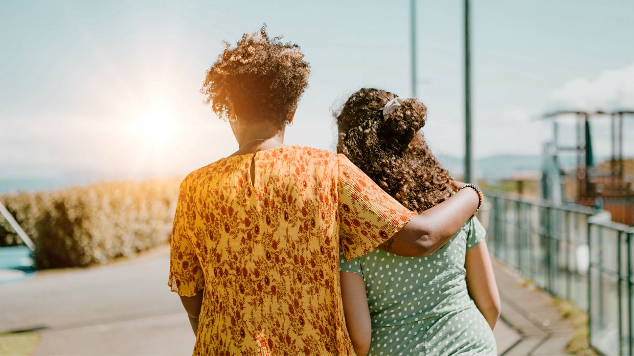 Mother and daughter walking together.