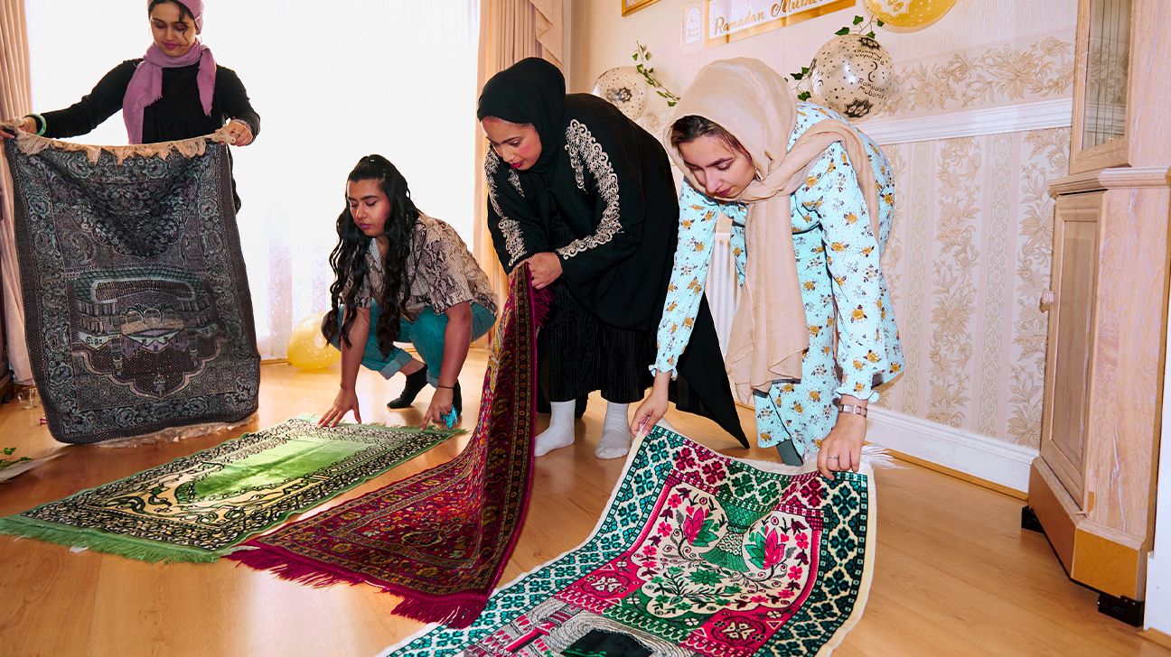 Muslim women getting ready to pray for Ramadan