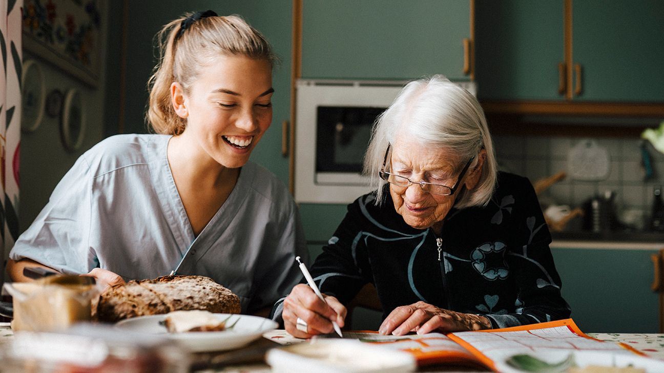 Senior woman with lung cancer spending time with in-home caregiver