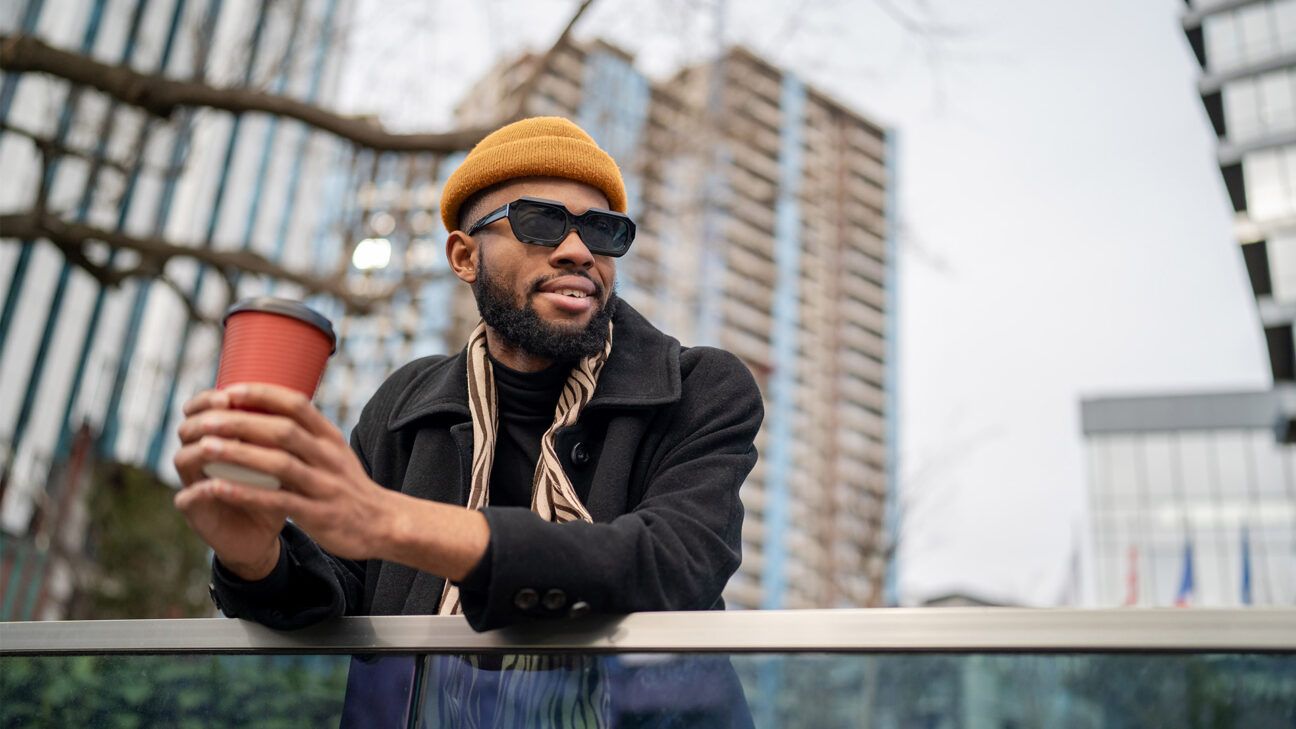 Man holding a cup of coffee.